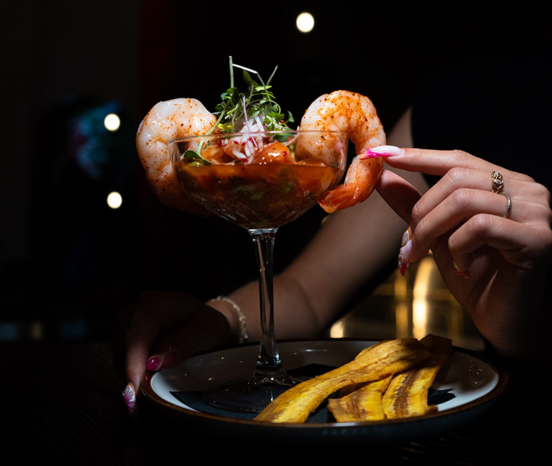 A shrimp cocktail and plantain chips served at Coca Lounge, a top bar and lounge in East Meadow, NY
